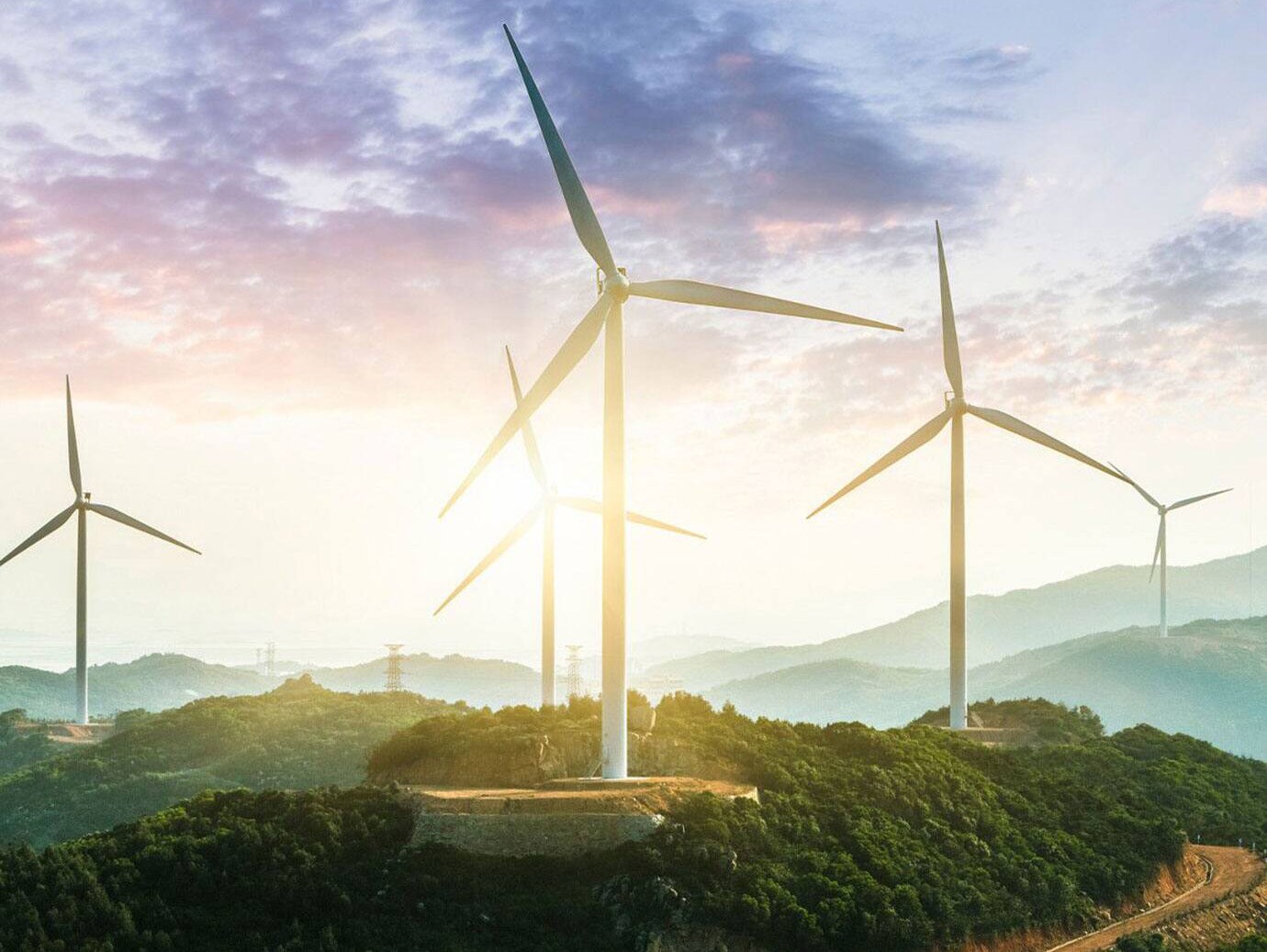 Group of windmills in a hilly area with valleys