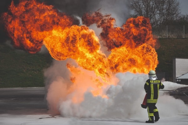 man with fire extinguisher