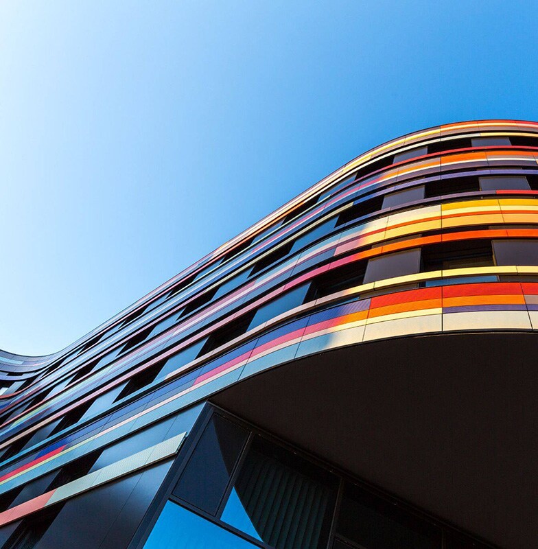 Frog's eye view of a modern curved building