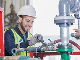 Man is smiling and working