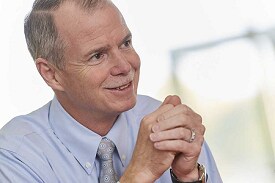 George R. Oliver, CEO of Johnson Controls, smiling